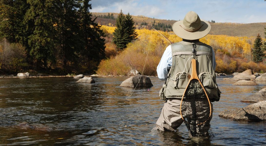 man fly fishing